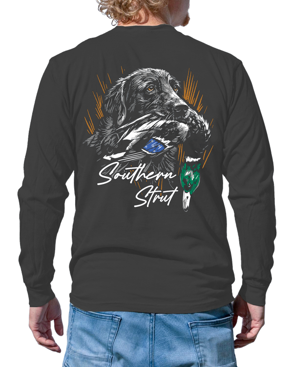 Marsh Born Long Sleeve in Pepper, back print of a black Lab carrying a drake mallard in front of gold marsh grass
