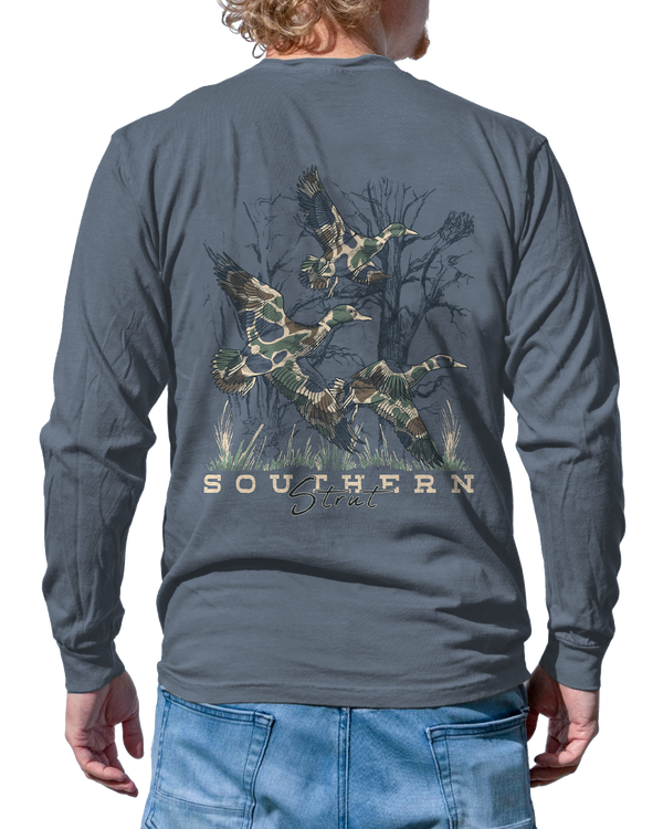 Duck Camo Trio Long Sleeve in Blue Jean, back print of three camo-pattern mallards flying over marsh grass
