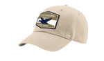 A khaki Southern Strut original hat with a hexagon patch with a top and bottom brown strip and a white one separating it. At the top "Southern Sturt," underneath that a silhouette of a duck. 